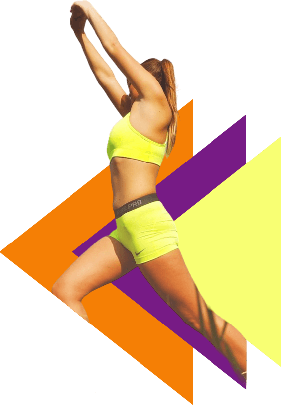 A woman in yellow shorts and bra jumping.